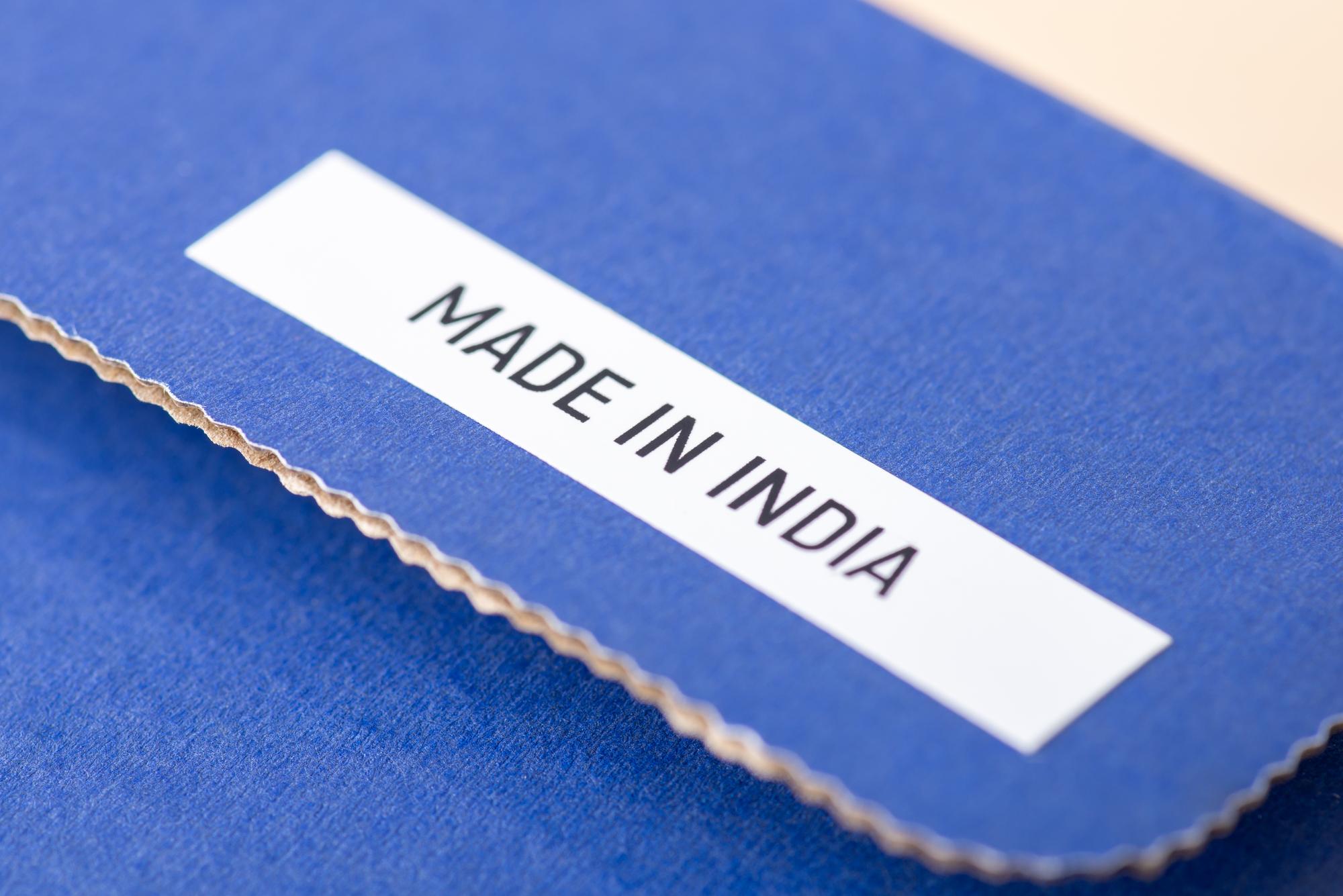 Row of embroidered labels on cotton